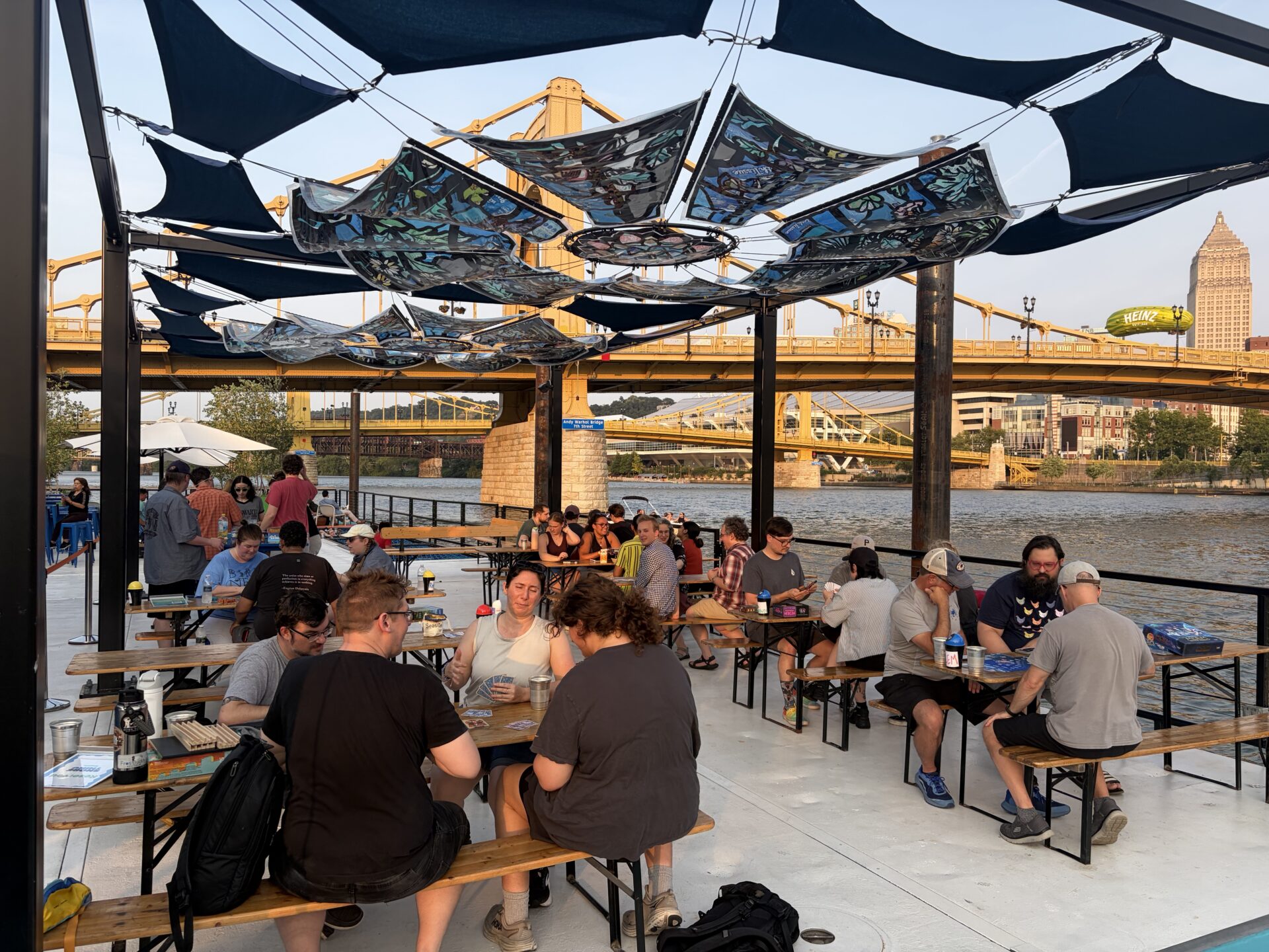 People playing board games on the Shore Thing barge